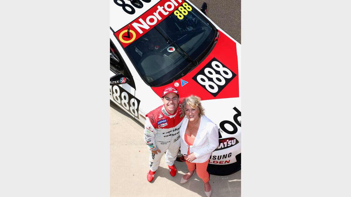 Craig Lowndes and Bev Brock unveil Team Vodafone's retro Bathurst livery ready for the weekend. Photo: Getty Images. 