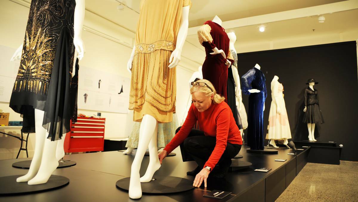 BATHURST:  Acting curator Robina Booth puts the final touches on After Five: Fashion from the Darnell Collection, which opens tonight at the Bathurst Regional Art Gallery. Photo: ZENIO LAPKA 071113zbrag1