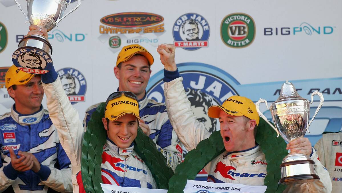 2004: Rick Kelly and Greg Murphy of the Kmart Racing Team celebrate after winning the Bathurst 1000. Photo: Getty Images