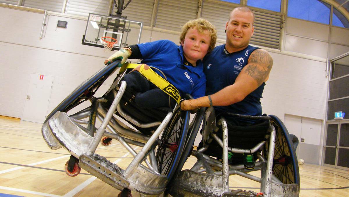 BATHURST: Nine-year-old Bathurst lad Harry Clist has found his place among a band of elite wheelchair athletes. Here he and Paralympian Ryley Batt work on some wheelchair rugby moves during a training session in Sydney recently. 062413harry&Ryley