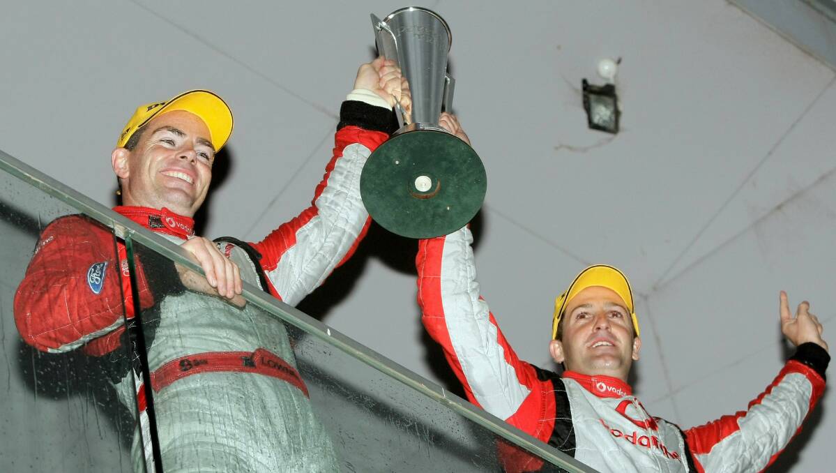 2007: Craig Lowndes and Jamie Whincup of Team Vodafone celebrate with the Peter Brock Trophy after winning the Bathurst 1000. Photo: Getty Images. 