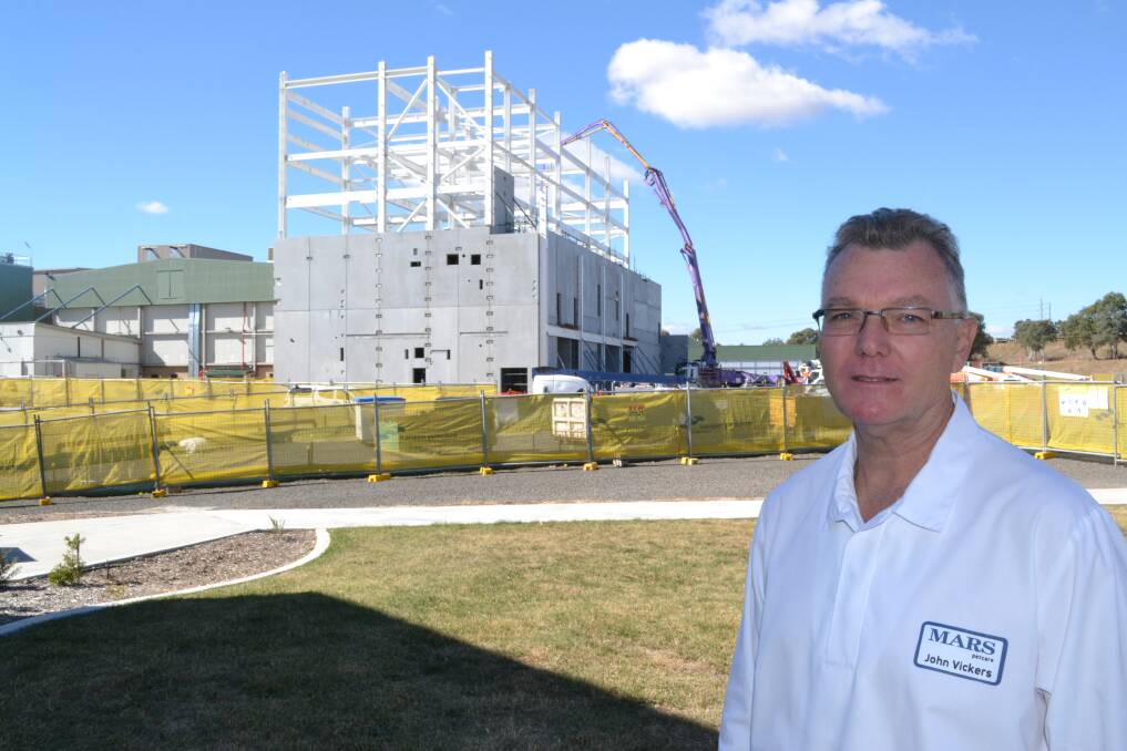 GOING GREEN: Mars Petcare Bathurst plant manager John Vickers is thrilled with the way the new $100 million dry pet food factory is coming along. Photo: CHRIS SEABROOK	 050613cmars2