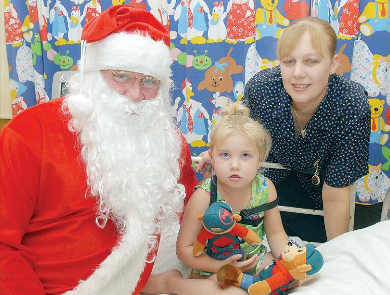2007: Santa met Breanna Lewis and nursing sister Tracey Grabham on a recent hospital visit. 1221psanta