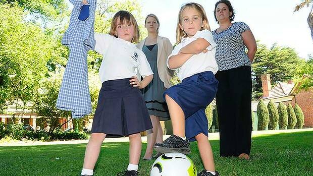 Bathurst Primary School students Bella Morris and Elliott Miller are thoroughly unimpressed with being told that they have to wear skirts at school.