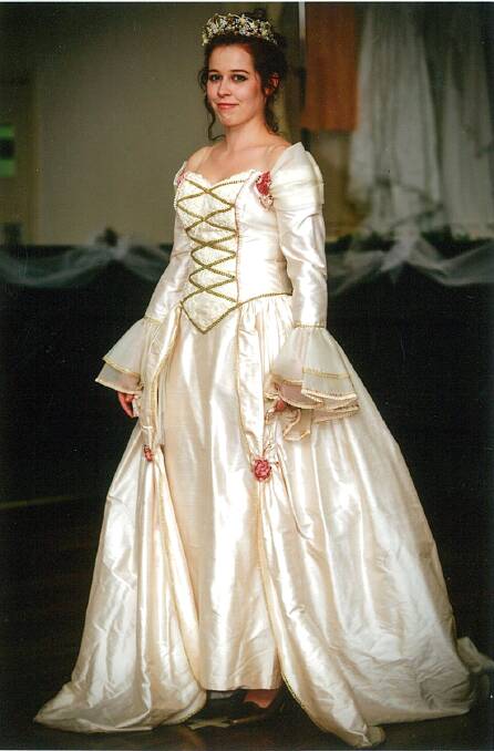 1990s: Cream silk medieval dress with gold rimming and laced down the front with gold trim. This dress was worn by Denise Toohey on her wedding Day.