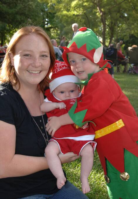 2008: Shana Turner and her children, three-month-old Charlotte and three-year-old Preston got into the festive spirit at last night’s Carols by Candlelight in Machattie Park.