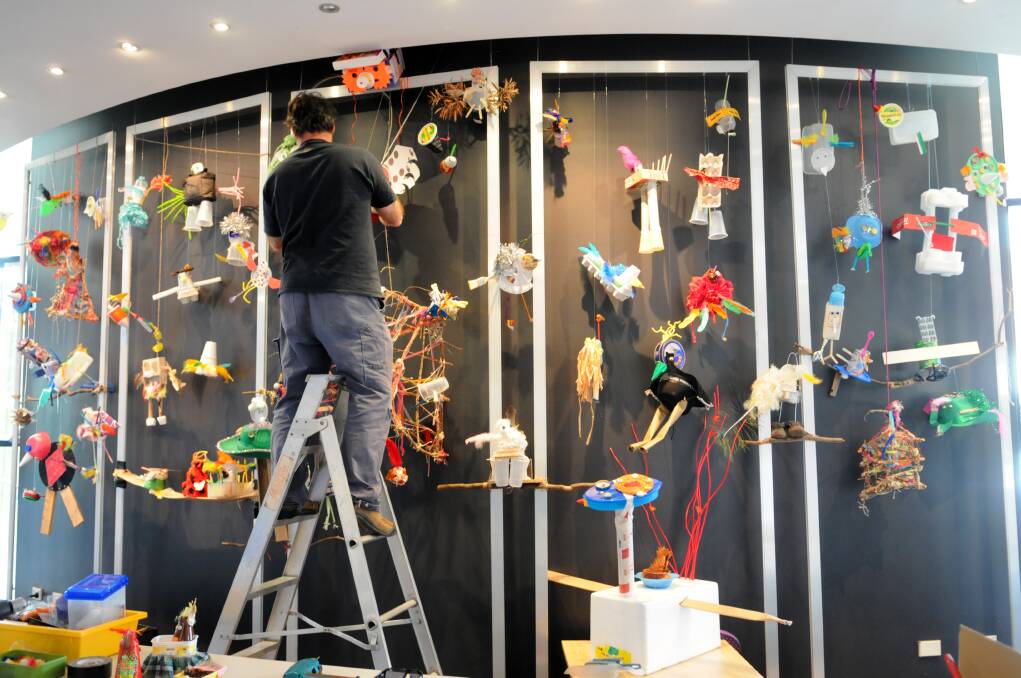 SEPTEMBER: Students from across the region have created some extraordinary JIRBs (junk-integrated-recycled-birds) that now fill the foyer of the Bathurst Memorial Entertainment Centre with colour. Photo: ZENIO LAPKA 082613zbmec6
