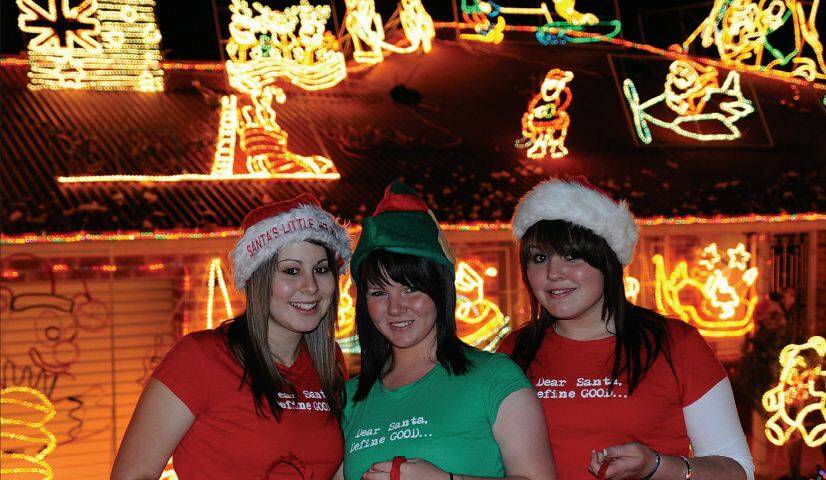 2008: Jennifer Butler, Grace A’Hearn and Jessica Nugent welcome passers by at the Put Christmas In Your Street lights display with lollies and cheery smiles.