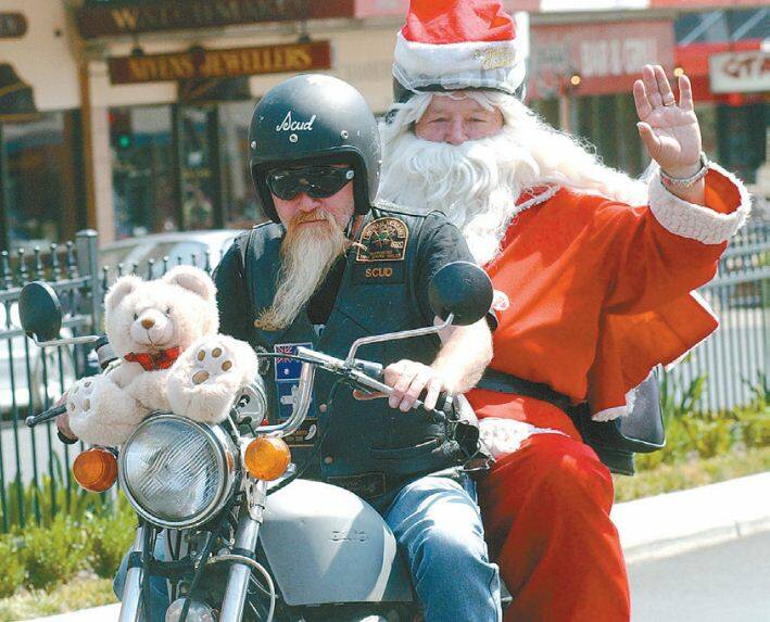 2006: Biker ‘Scud’ Morcom pilots Santa Claus on Bathurst bikers’ Great Western Christmas Toy Run. 1209pbikers4
