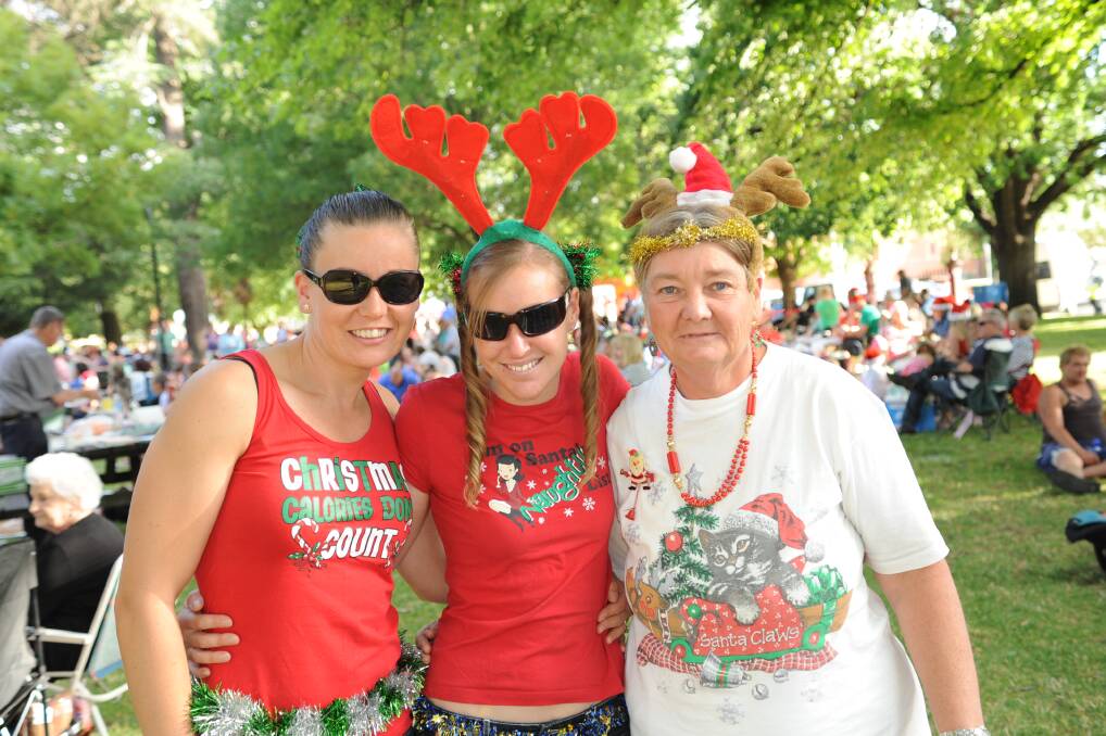 MERRY CHRISTMAS: Jessica Coleman, Kelly Moppett and Margaret Hammond. Photos by: CLARE LEWIS 151213mac35 