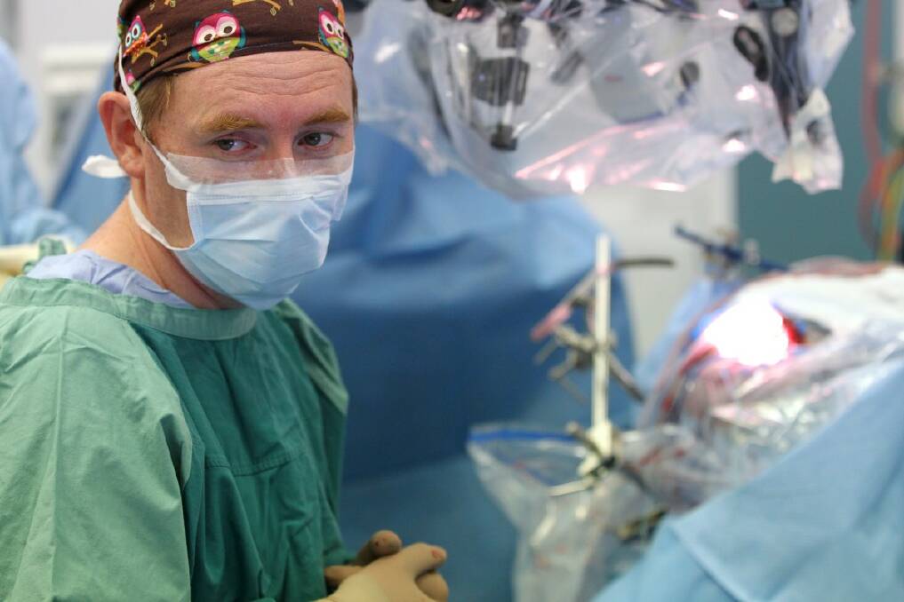 BRAVE BROOKE: Paediatric neurosurgeon Associate Professor Brian Owler operates on Brooke MacKenzie's brain at Westmead Children's Hospital in Sydney. Photo: Janie Barrett