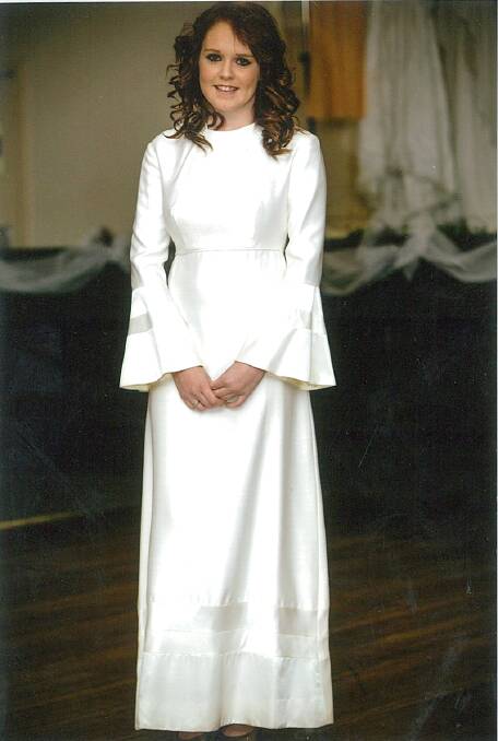 1970s: Shantung dress with fitted bodice and straight skirt to the mid calf and then two bands or material cut on teh bias and then falling into an A line skirt to the floor. A hood was attached to the dress. The dress was worn by Dianne at her wedding and worn on the night by Monique Jones.