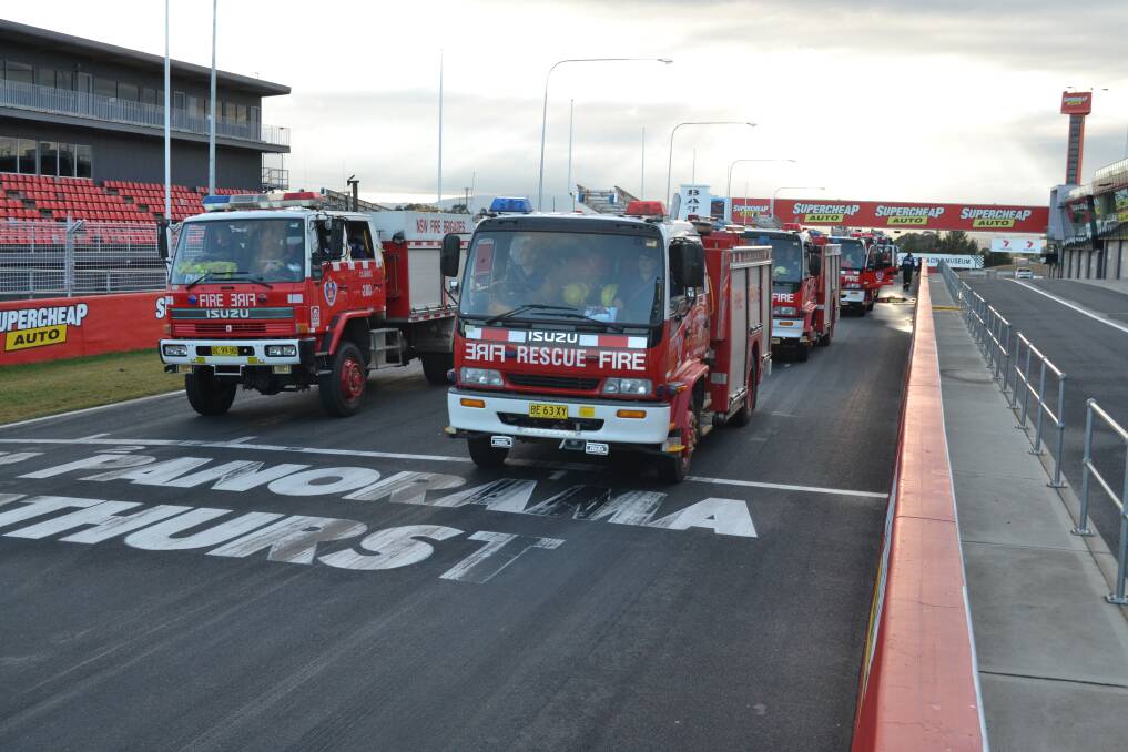 REGION WEST STRIKE TEAM: More than 90 firefighters and 21 trucks have pulled out of Mount Panorama, Bathurst, this morning on a mission to protect embattled communities in the Blue Mountains as the area braces for a day of hellish conditions.
