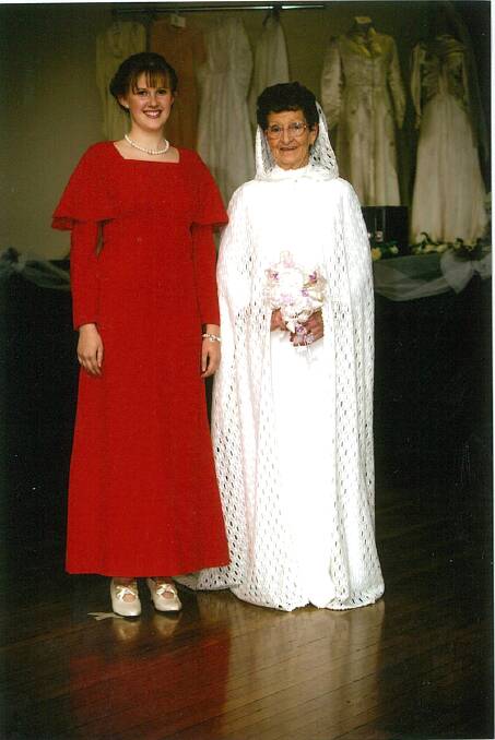 1972: A straight crimplene dress trimmed with guipure lace. A lace coat with hood was worn over the dress. Barbie Meehan wore this dress when she married Keith in 1972 and was worn by Dorothy Campbell at the function. The bridesmaid's dress was worn by Jessica Elliott. 