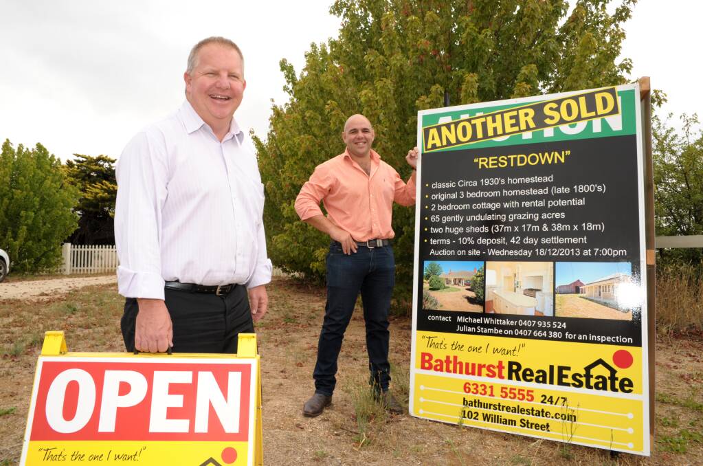 SOLD: Bathurst Real Estate owner Michael Whittaker and rural agent Julian Stambe celebrate the sale of iconic Restdown for more than 1.1million. Photo: Zenio Lapka 021414zsale