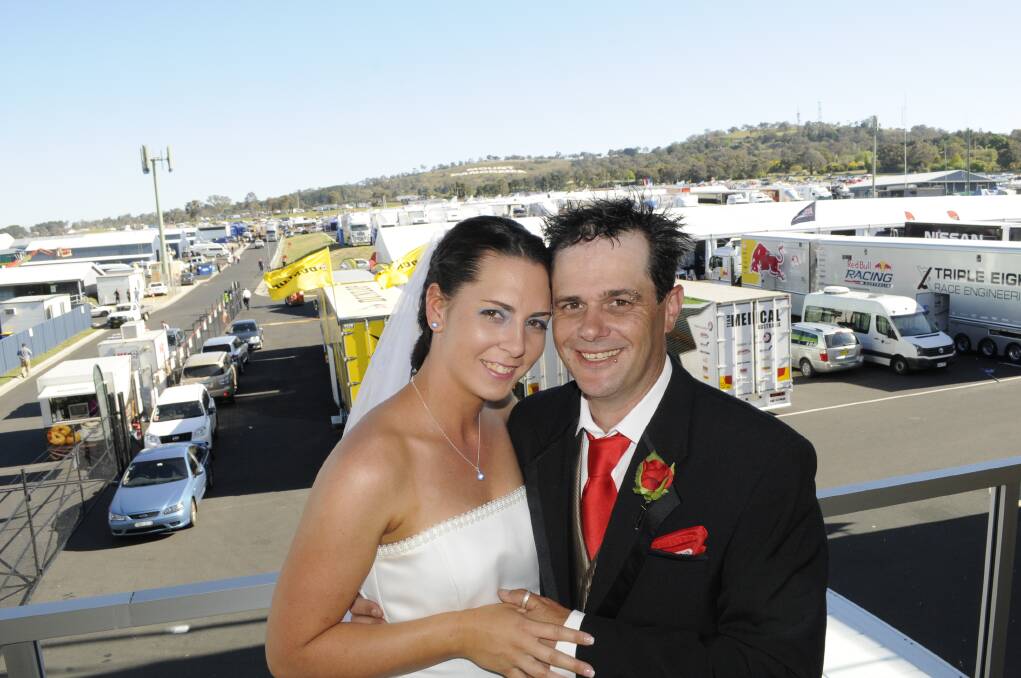 2013: India and Shane Clarke pose for photos following their wedding at Mount Panorama on October 9. The wedding ceremony was performed by Reverend Stephen Peach in Pit Lane. The Griffith couple married in the presence of other race fans, volunteers, drivers and the media.