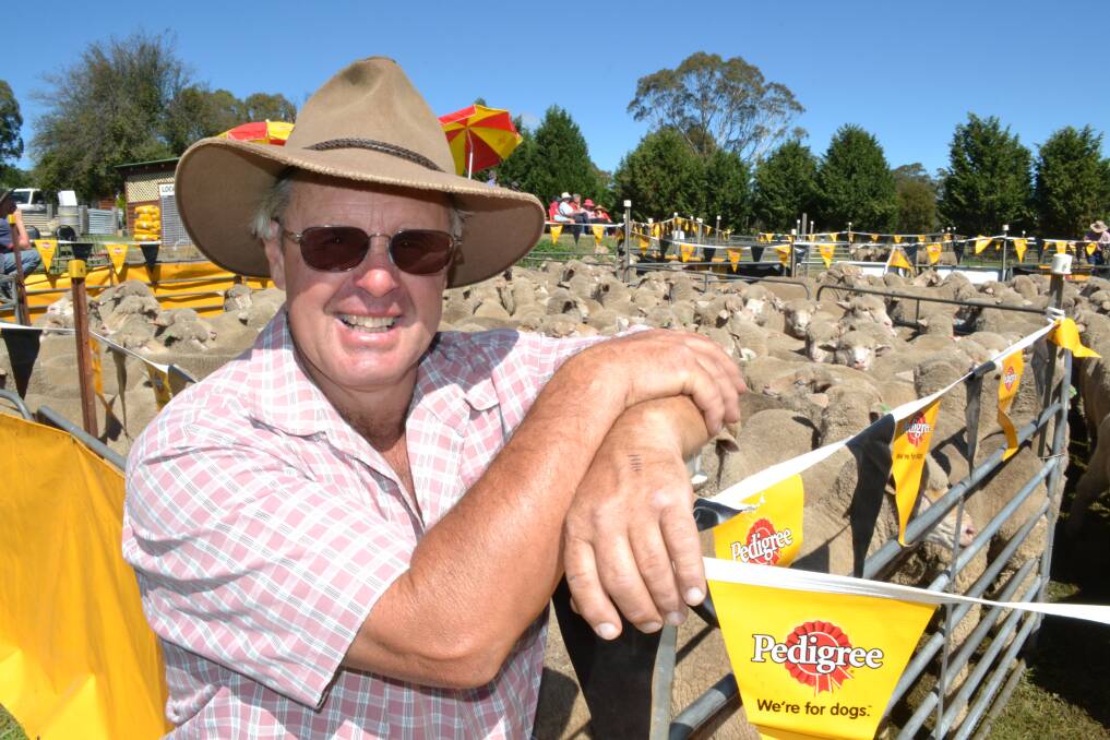 APRIL: Charity dog trial organiser Peter Moore with a pen of sheep at the Tarana Hotel.