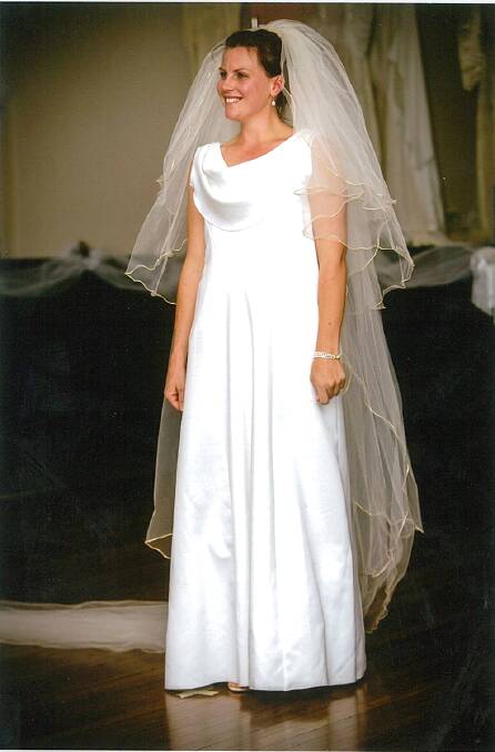 1990s: White crepe and georgette sleeveless dress with large cowl neckline. 