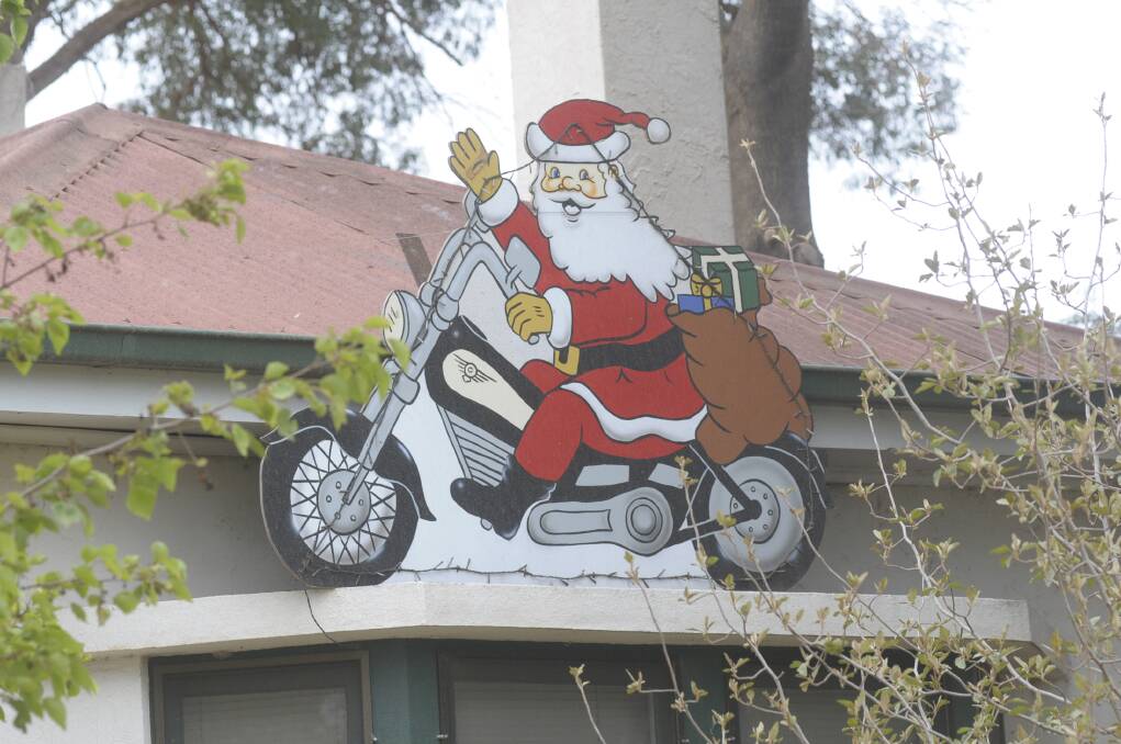 2009: One Bathurst resident seems to  believe it's never too early to spread some festive cheer as seen on the front of a house in Brilliant Street 58 days out from Christmas.