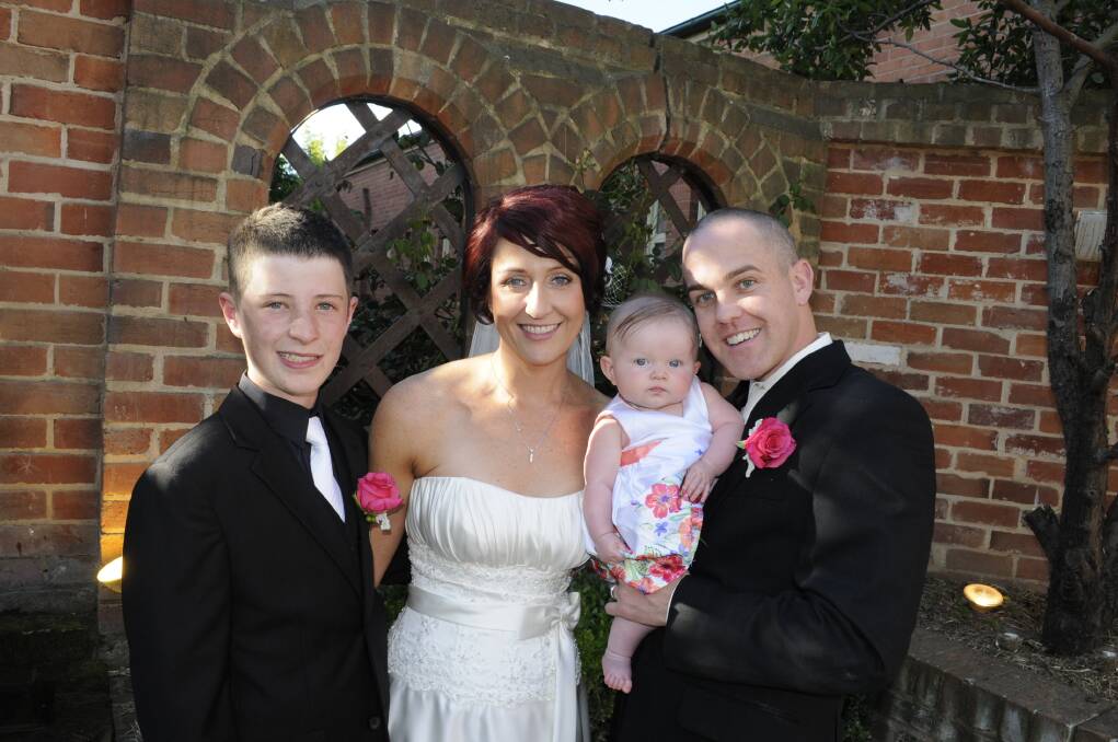 2013: JUST MARRIED: Joel McDonald with his mum, bride Angela, and groom Sean Smith, holding baby Lucy,   following the couple’s surprise wedding ceremony on Saturday, November 26.