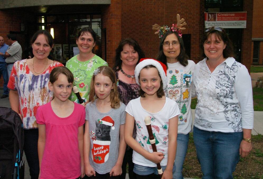 2011: Annette Press, Tracey Robinson, Janette Collins, Anna Ossig-Bonanno and Heather Kimbel and (front) Kalinda Robinson, Miranda Campbell and Emily Press. 121111zcarols4