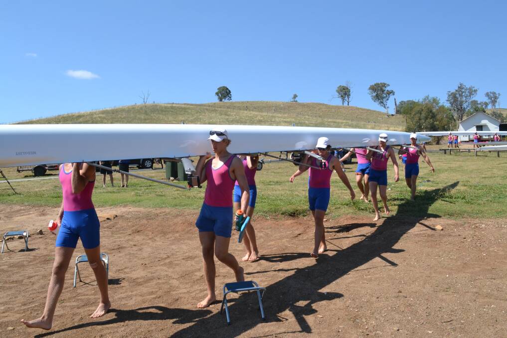 WORKING HARD: Rowers from St Joseph’s College in Sydney hit the water at Ben Chifley Dam during their week-long training camp. Photo: MARK RAYNER 	012413joeys