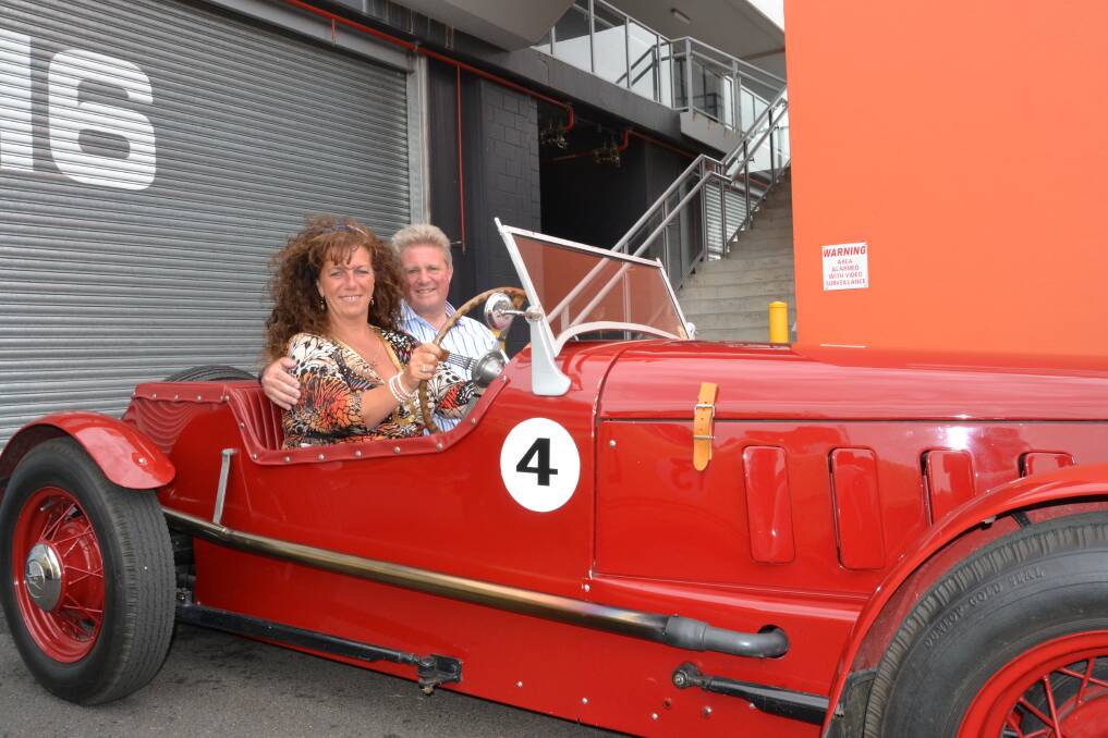 JUST VISITING: The 9th Earl and Countess Bathurst took a spin around Mount Panorama as part of their whirlwind tour of Bathurst yesterday.  Photo: KATE BURKE.	 012414earl2