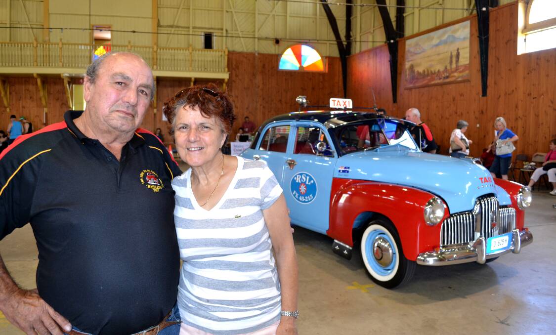 RESTORED: Sydney couple Eddy and Vivian Tabone wait as their 1953 FX Holden taxi is scrutineered at Bathurst Showground yesterday. The couple is in town for the FX FJ Holden Nationals. Photo: ZENIO LAPKA 	122812zfj8