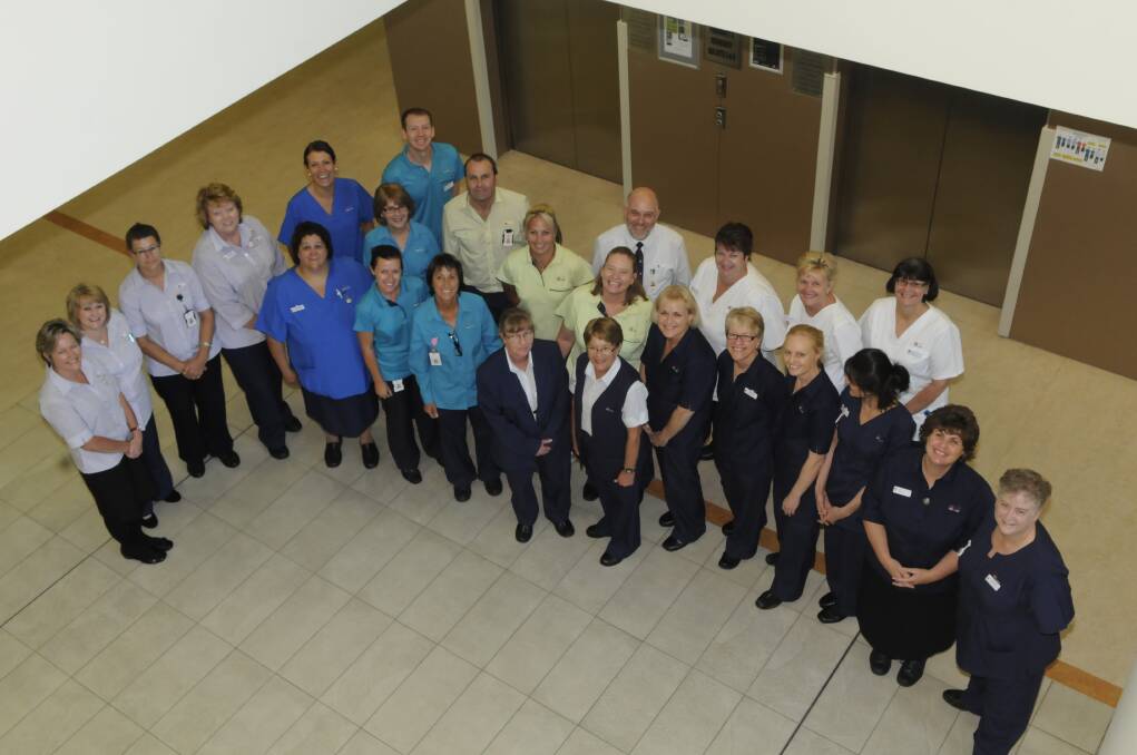 COLOUR CODED: Staff at Bathurst Base Hospital wearing the new colour-coded uniforms which have been designed to make staff easy identifiable. Photo: PHILL MURRAY 	032013pbxbase