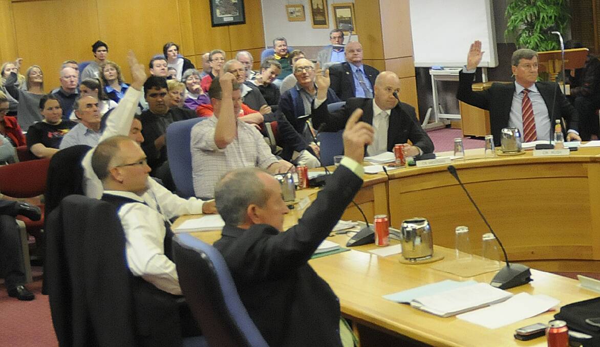 HIGH FIVE: Councillors Bobby Bourke, Warren Aubin, Michael Coote, Greg Westman and Gary Rush cast the five votes that made Cr Rush the new Bathurst mayor last Wednesday night. Photo: CHRIS SEABROOK	 091813cnewmayr7