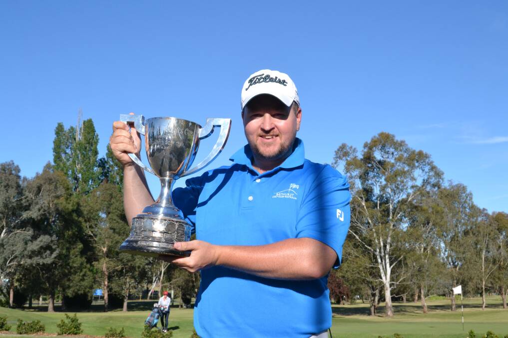 WORTH THE TRIP: Cabramatta player Troy Norris with the Bathurst Open trophy after winning at his first attempt. 	102713sdnorris