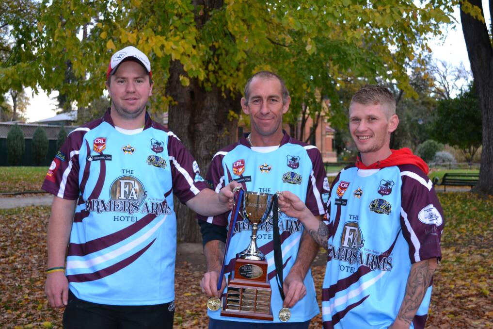 SUCCESS: Villages United beat Portland on Friday night to claim the inaugural Rodney Murray trophy. Pictured with the cup are, from left, Trent Guihot, Dave Smith and Ricky McCabe. 