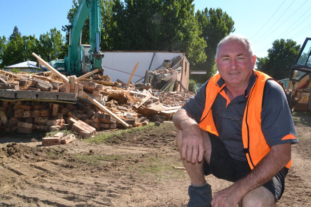 SQUASHED: It was the end of the line for a Bathurst landmark yesterday when the squash courts at the corner of Havannah and Howick streets were demolished to make way for student accommodation. Developer Rob Reece was on the site supervising the work at the start of the $6.5 million project. Photo: BRIAN WOOD 	020713squash1