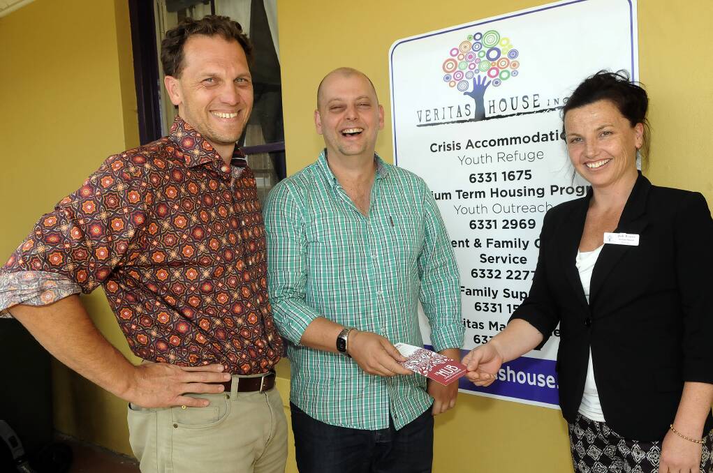 CHEQUE MATES: Councillor Jess Jennings and The Hub's Ross McDonald hand over a cheque for $300 to Veritas House manager Jody Pearce, launching a new Christmas fund for the charity. Photo: PHILL MURRAY 	111412pveritas