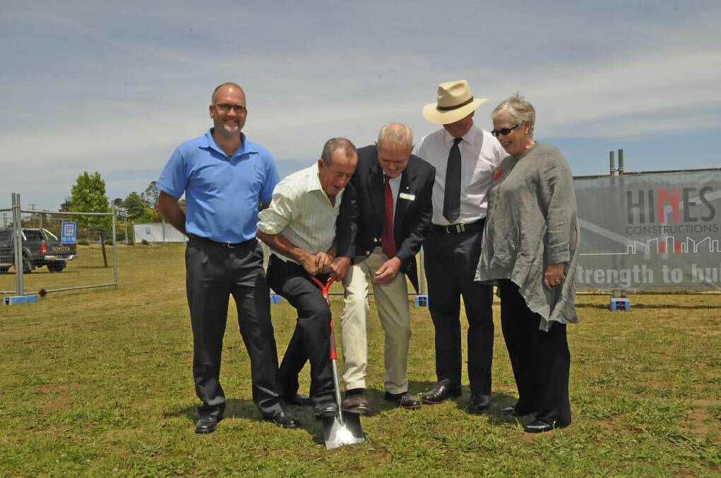 GROUNDBREAKING: Deputy mayor Cr Ian North, Cr Michael Coote and Mayor Monica Morse look on as Cr Bobby Bourke and Norwood Park's general manager Stephen Beer turns the first sod at the site of the new crematorium. Photo: PHILL MURRAY 	111412psod