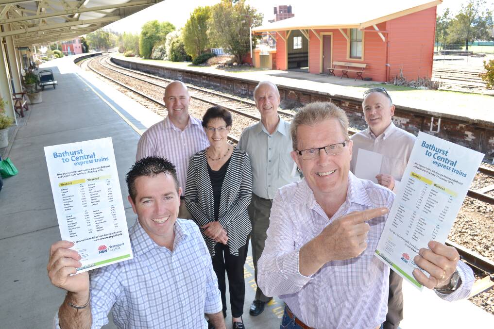 ON TIME: Rail Action Bathurst (RAB) members (back) Greg Westman, Margaret Hollis, Max Turnbull and Chris O’Rourke joined Bathurst MP Paul Toole and RAB chairman John Hollis yesterday morning to welcome the new timetable for the Bathurst Bullet. Photo: CHRIS SEABROOK 	0923122cdayrail