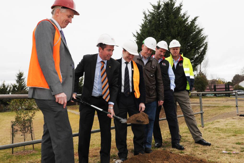 PUT YOUR BACK INTO IT: Bathurst High principal Geoff Hastings, Member for Bathurst Paul Toole, Denison College principal Craig Petersen, Public Works project director James Smith, Hines Constructions managing director David Hines and Hines Constructions’ Nigel Smith were all at Bathurst High for the official sod turning. Photo: ZENIO LAPKA 	062413zgym