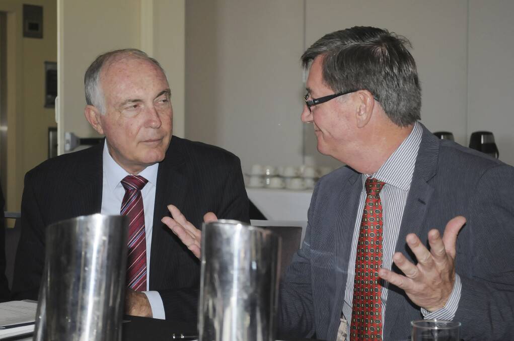 THIS IS HOW IT IS: Deputy Prime Minister Warren Truss listens as Bathurst mayor Gary Rush makes his case during a visit to Bathurst yesterday. Photo: CHRIS SEABROOK 	012814ctruss1