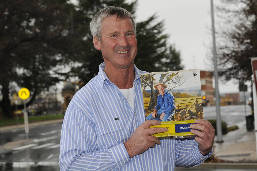 CALLING COVER STARS: Perthville resident Derek Larnach was honoured on the cover of the Yellow and White Pages last year for his Livestock for Lives charity which funds research into rare cancer. 	062513pdereck 