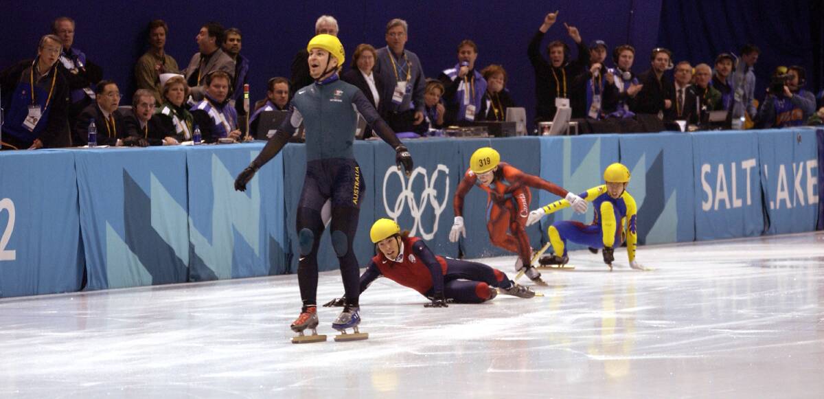 THAT’S GOLD: Australia’s first Winter Olympic gold medal winner Steven Bradbury crosses the line while America’s Apolo Anton Ohno scrambles to claim second place after the men’s 1000m speed skating final during the Salt Lake City Winter Olympic Games in 2002. Mr Bradbury is Bathurst bound for the annual CSU Blues Ball tonight. Photo: Steve Munday/Getty Images