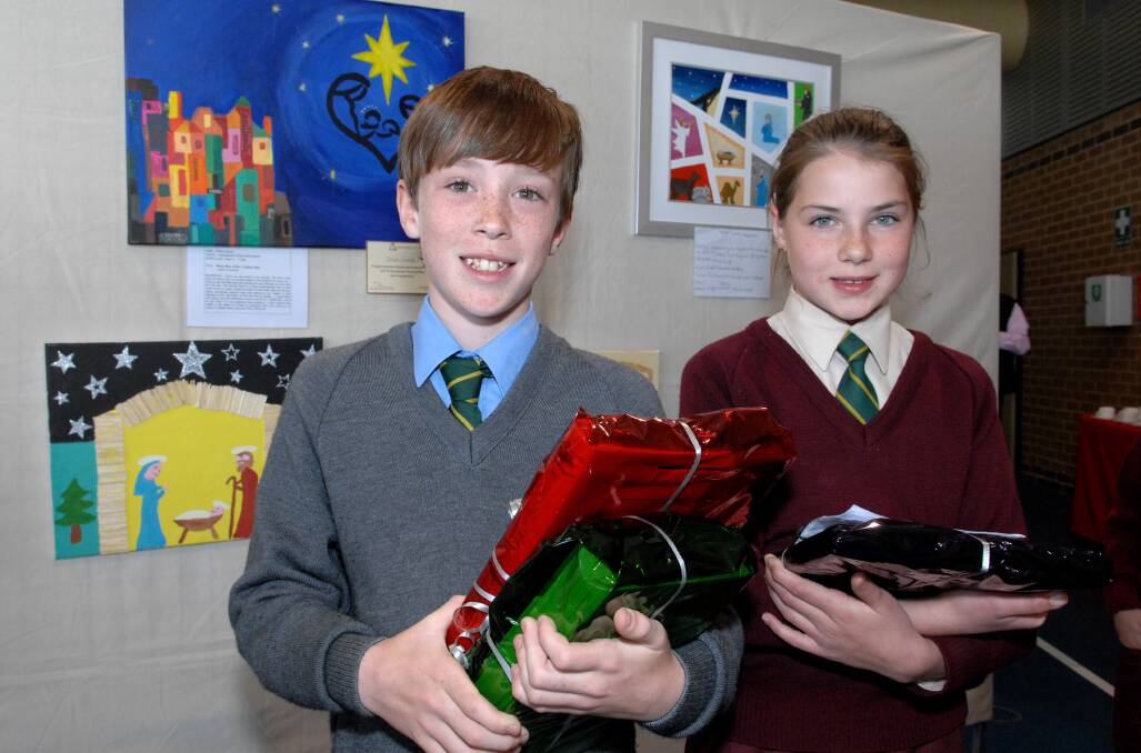 GOOD JOB: Assumption School Year 5 student Ethan Cusick won first prize in his section as well as the Director’s Award and Isabelle Barnden Northey took out the Catholic Development Fund Award in the Christmas Story Art Competition. WELL DONE: St Philomena’s Year 6 student Abigail Searle was delighted about being highly commended. 	091313zart1, 2