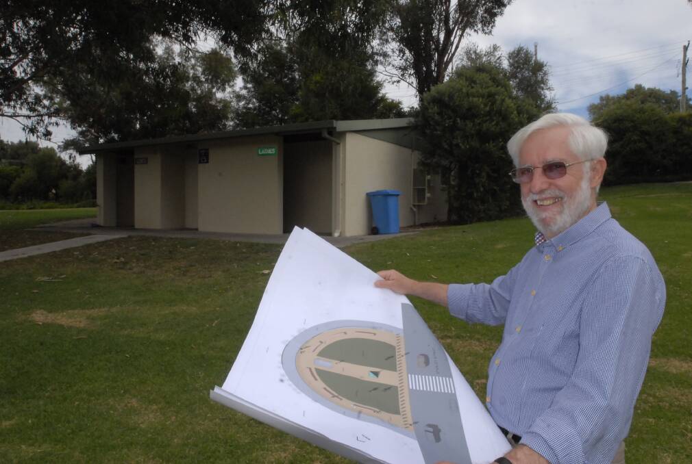 TOP MODEL: Local architect Henry Bialowas with his plans for the flagstaff monument that will be built at Bicentennial Park. Photo: CHRIS SEABROOK 	032613cmonu2