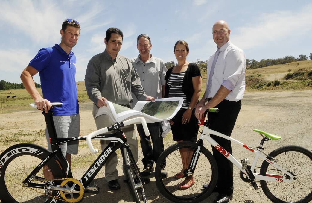 THE WHEEL DEAL: Home-grown cycling champion Mark Renshaw, Bathurst Regional Council's Michael Spiteri, Bathurst Cycling Club's Mark Windsor and Toireasa Gallagher, and Councillor Greg Westman at the site of Bathurst's planned cycle park yesterday. Photo: PHILL MURRAY 	112312pbikes1
