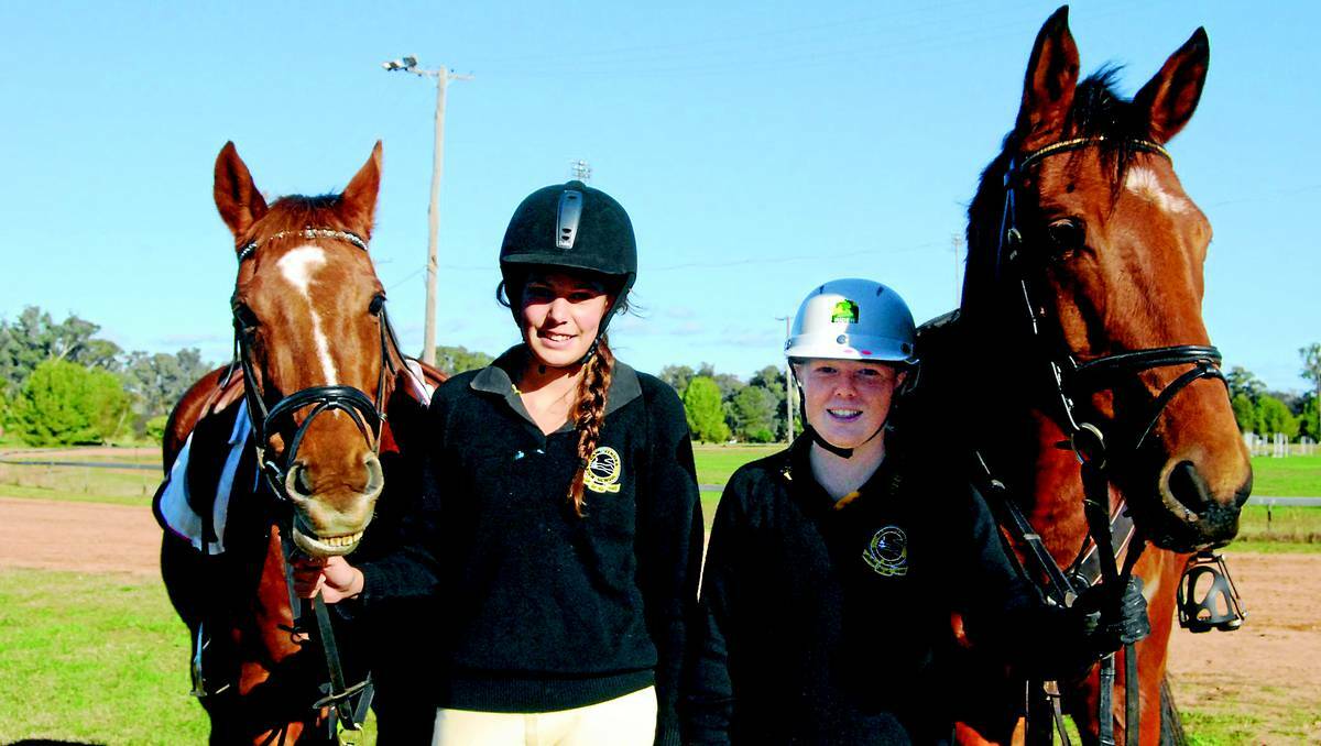 CANOWINDRA: Jennifer Holmes and Hayley White with horses Amy and Wally, did a week of work experience with the Mounted Unit- NSW Police Force.