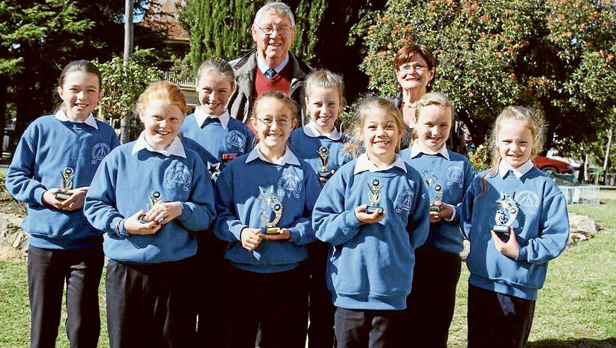 HARDEN: Trinity Catholic School Public Speaking Championship winners with their awards and judges Mr Barry Woolridge and Mrs Carmel Babos.