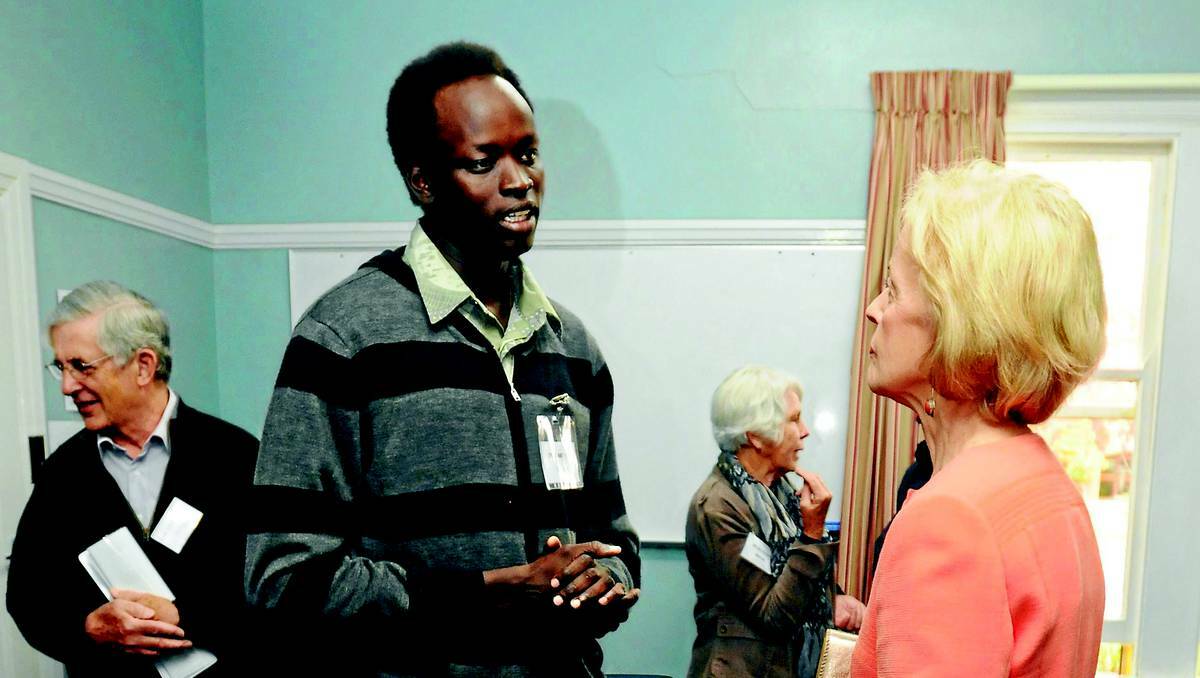 ORANGE: Migrant support youth mentor Deng Anthony meets the Governor-General Quentin Bryce. Photo: STEVE GOSCH 0513sggg2