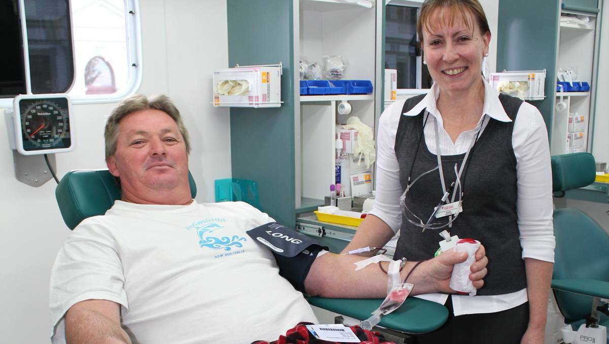 FORBES: Red Cross Blood Service Session Leader Rosalie Coelho helps Bill Gibson make his fourth donation.