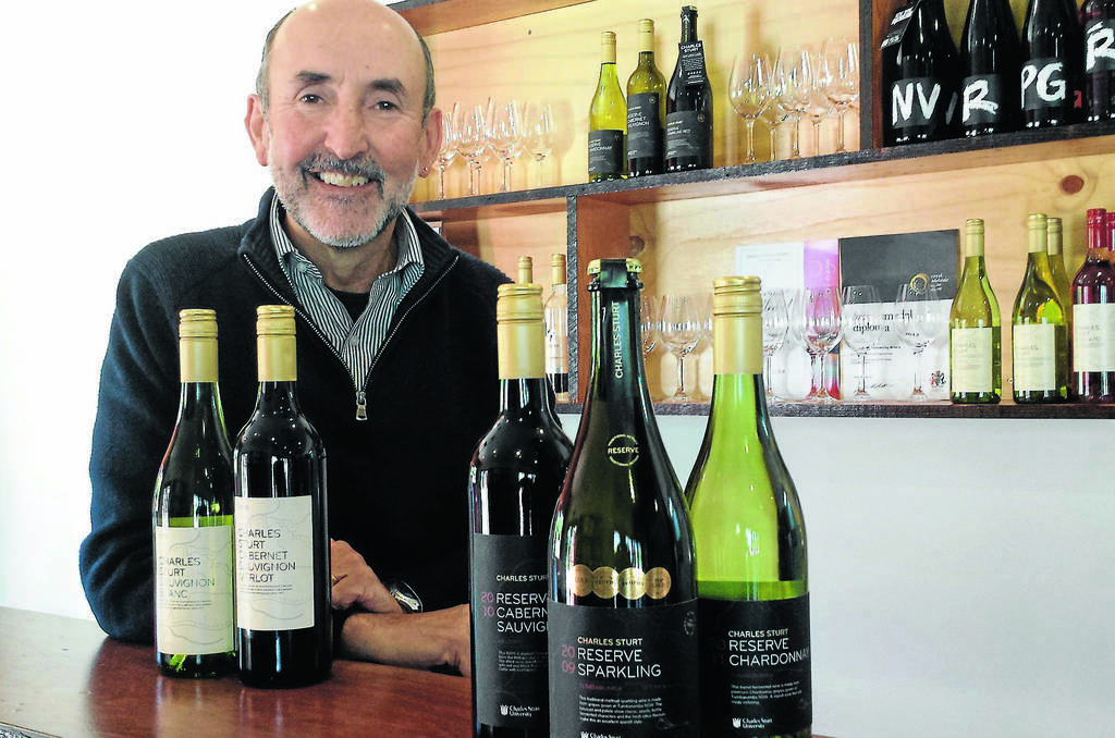 ORANGE: Charles Sturt Wines marketing manager Justin Byrne with the new labels that feature a map of the travels of Captain Charles Sturt.