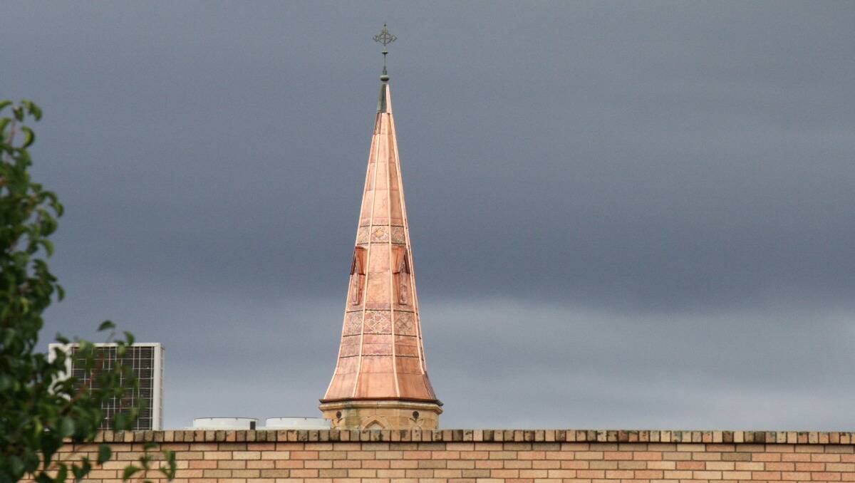 St Mary's church steeple in Mudgee on a cloudy day. Photo; Sam Potts
