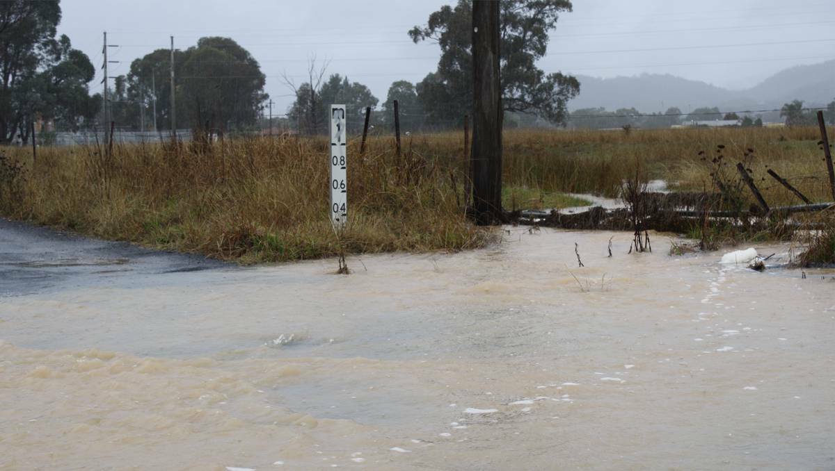MUDGEE: The causeway in Saleyards Lane, Mudgee, was flooded in Wednesday’s rain. The SES has reminded the public not to walk, ride or drive through flood waters.